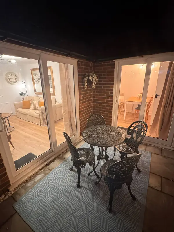 The enclosed courtyard with a little bistro table and chairs